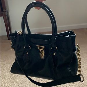 Michael Kors black satchel with gold accents.